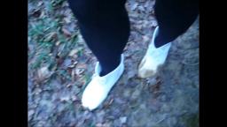 Jana walks in mud and puddles with her shiny white Chelsea rubber ankle boots trailer