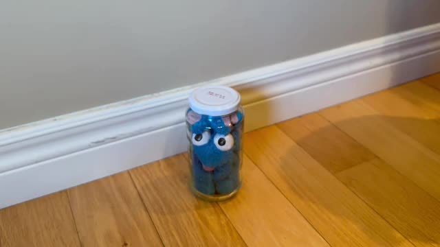 A STINKY BLUE RAT IN A JAR.