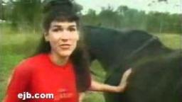 A horse poos on a lady's head